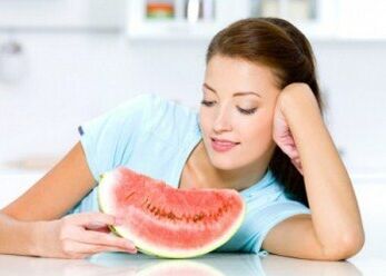 The girl follows a watermelon diet to fight excess weight. 