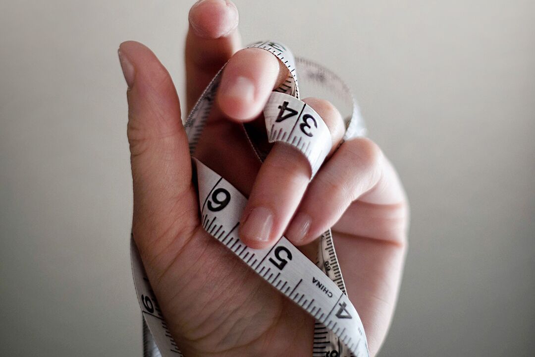 measuring tape in hand